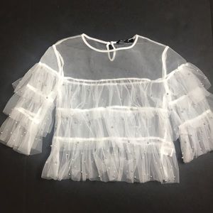 White top with silver pearls